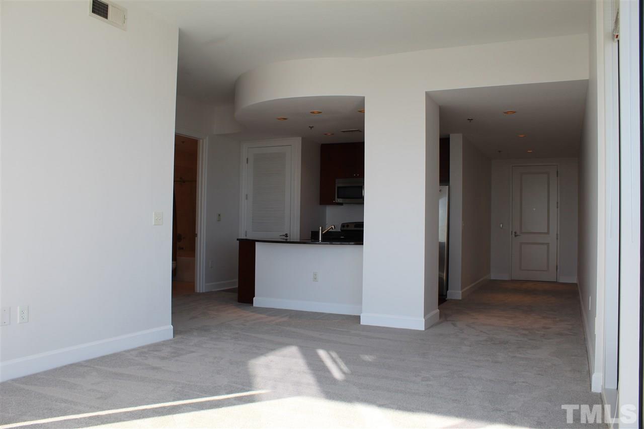 301 Fayetteville Street, Unit 2408 Raleigh, NC 27601 - Photo 7 of 19 View from the living room looking into the kitchen.