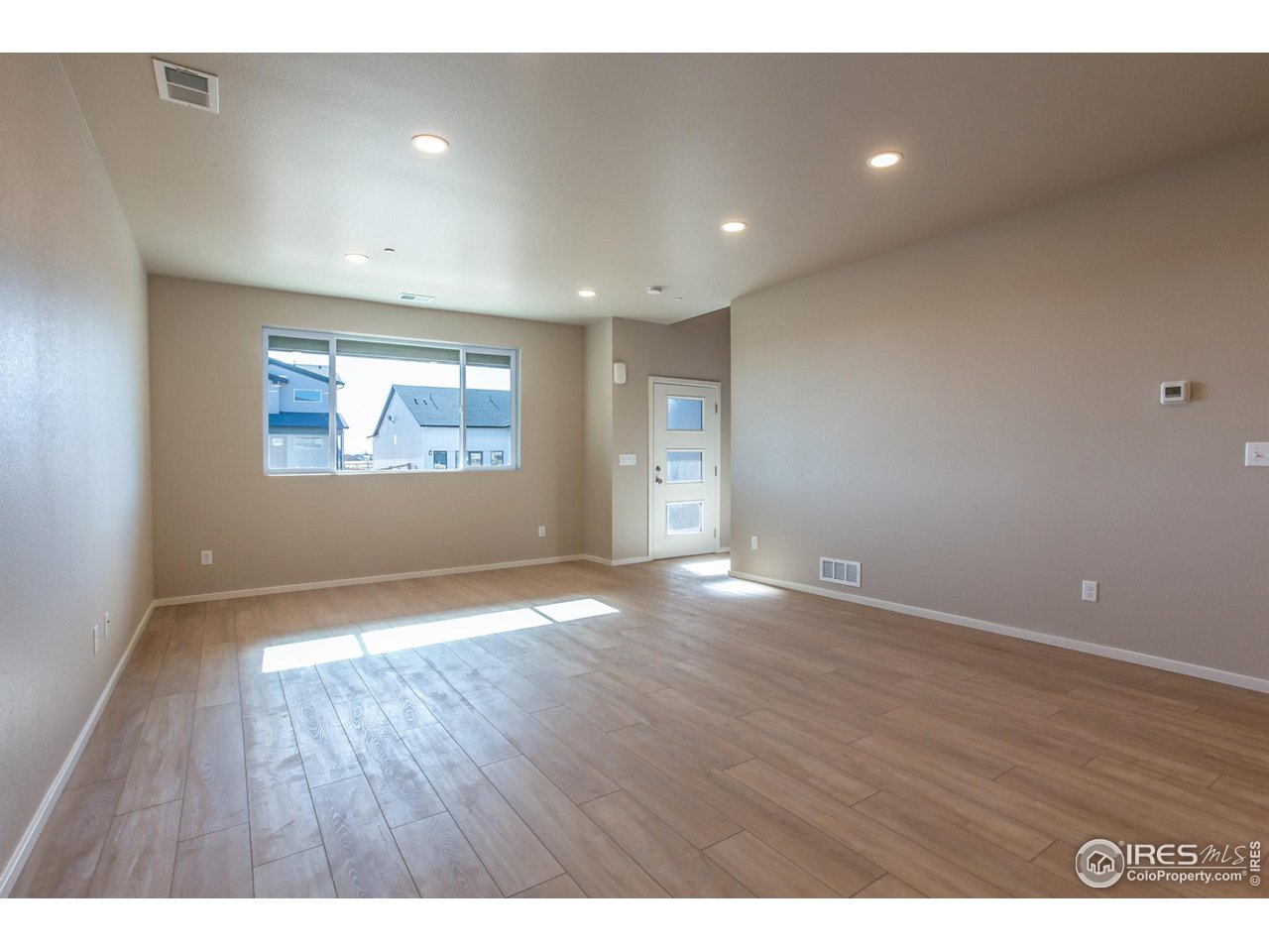 6825 4th St Road, Unit 2 Greeley, CO 80634 - Photo 3 of 34 EXAMPLE PHOTO: LIVING AND DINING ROOM