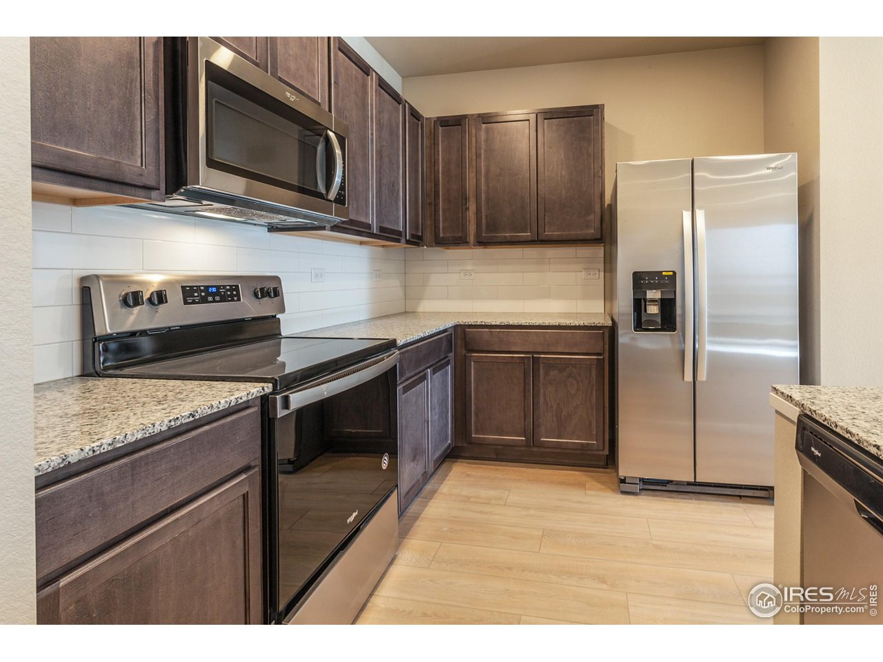 6825 4th St Road, Unit 2 Greeley, CO 80634 - Photo 8 of 34 EXAMPLE PHOTO: KITCHEN W/ SS. APPLIANCES
