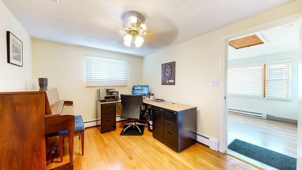 151 The Strand Winthrop, MA 02152 - Photo 15 of 36 a view of a workspace with furniture and a window