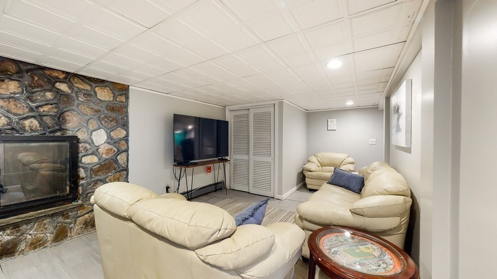 151 The Strand Winthrop, MA 02152 - Photo 19 of 36 a living room with furniture and a flat screen tv