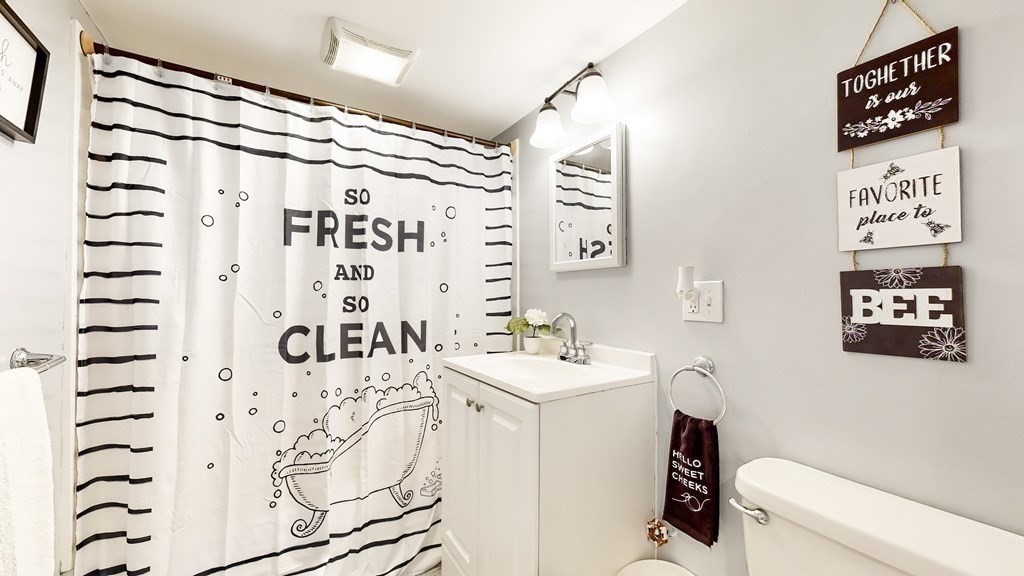 151 The Strand Winthrop, MA 02152 - Photo 26 of 36 a bathroom with a sink toilet and shower