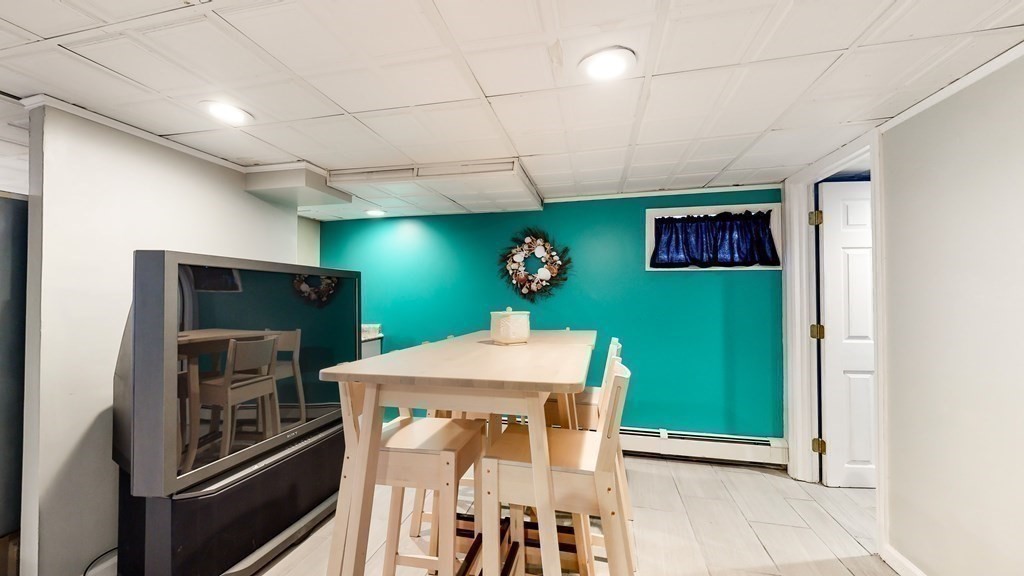 151 The Strand Winthrop, MA 02152 - Photo 28 of 36 a kitchen with a refrigerator and countertop