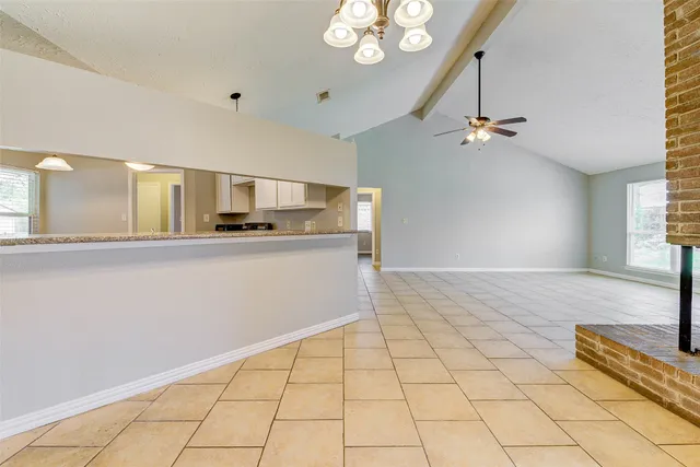 a view of a kitchen with furniture and chandelier
