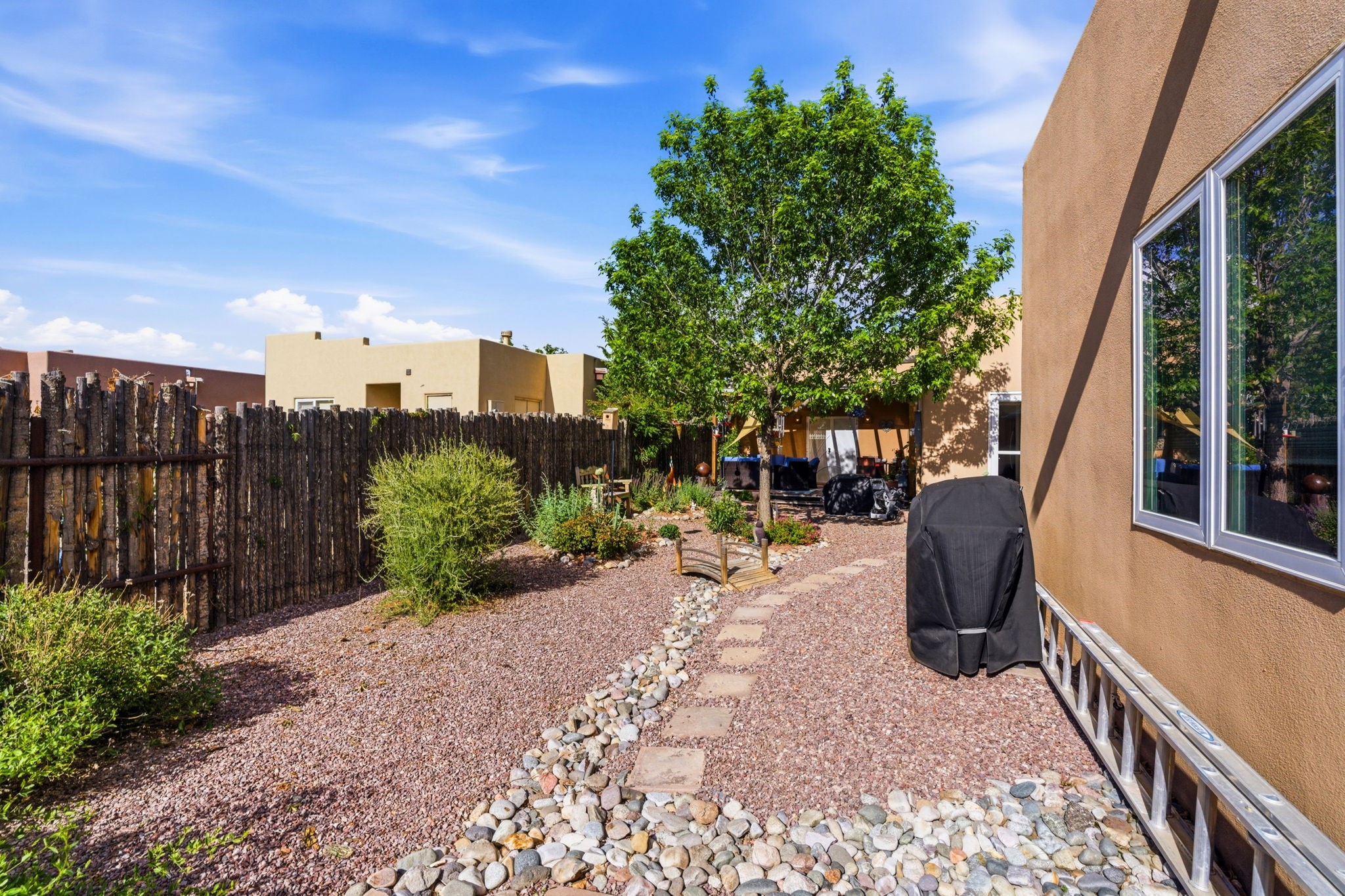 3 Silver Buckle Road Santa Fe, NM 87508 - Photo 33 of 34 Beautiful xeriscaped backyard with gray water irrigation system
