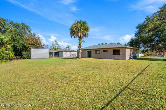 a view of a swimming pool and an outdoor space