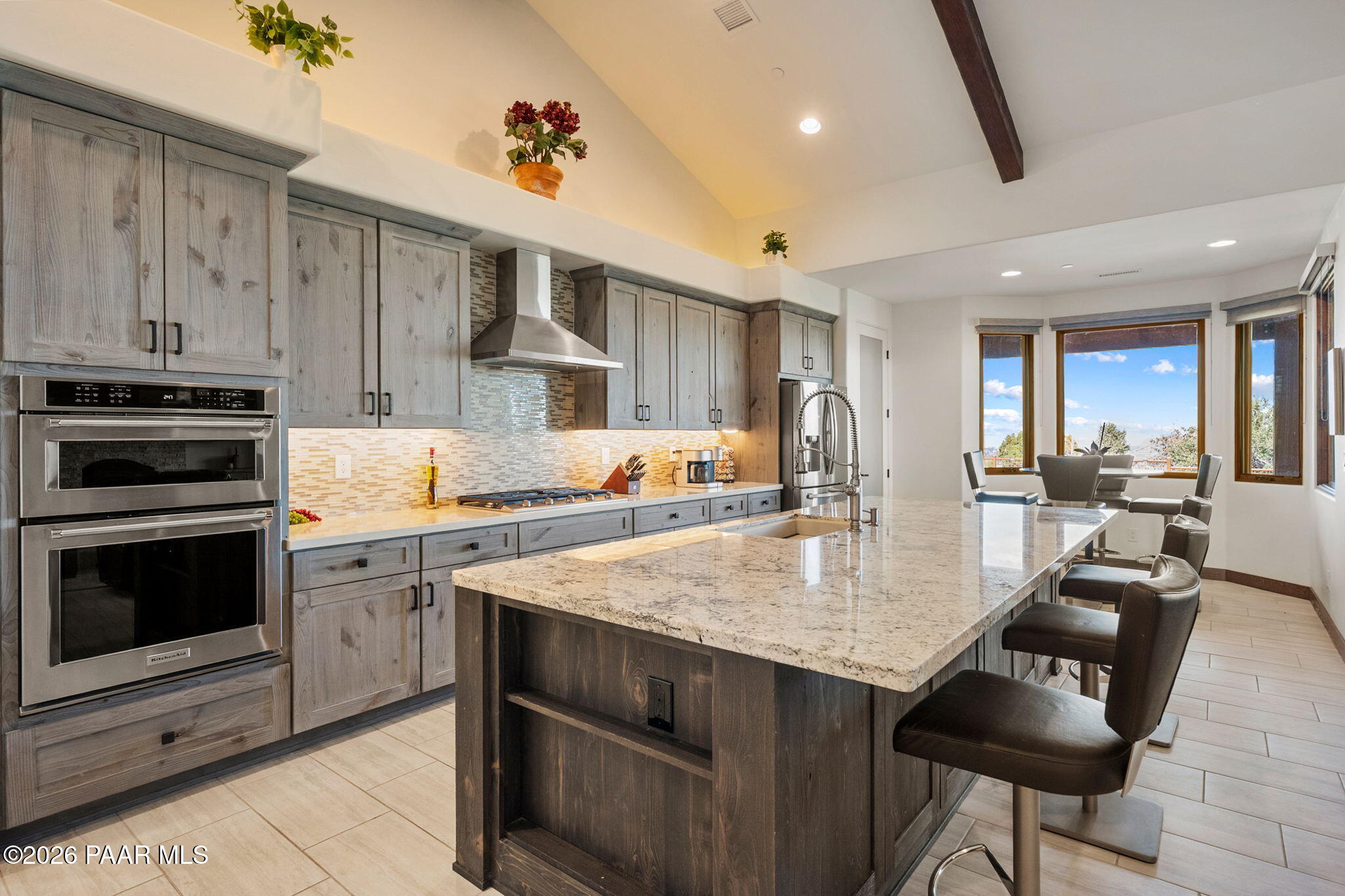 2140 Forest Mountain Road Prescott, AZ 86303 - Photo 12 of 56 a kitchen with kitchen island granite countertop wooden cabinets a stove and a oven