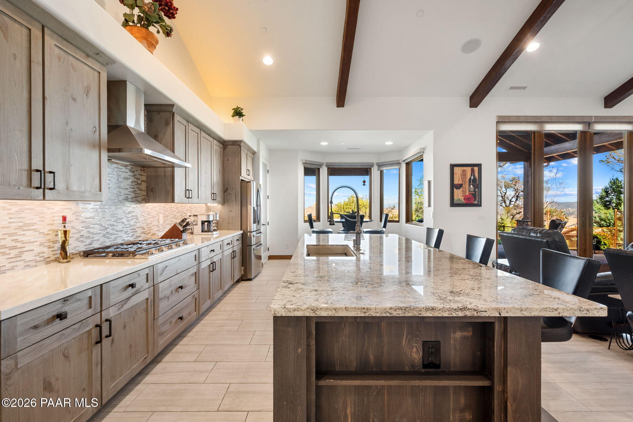 2140 Forest Mountain Road Prescott, AZ 86303 - Photo 14 of 56 a large kitchen with granite countertop a stove and large counter space