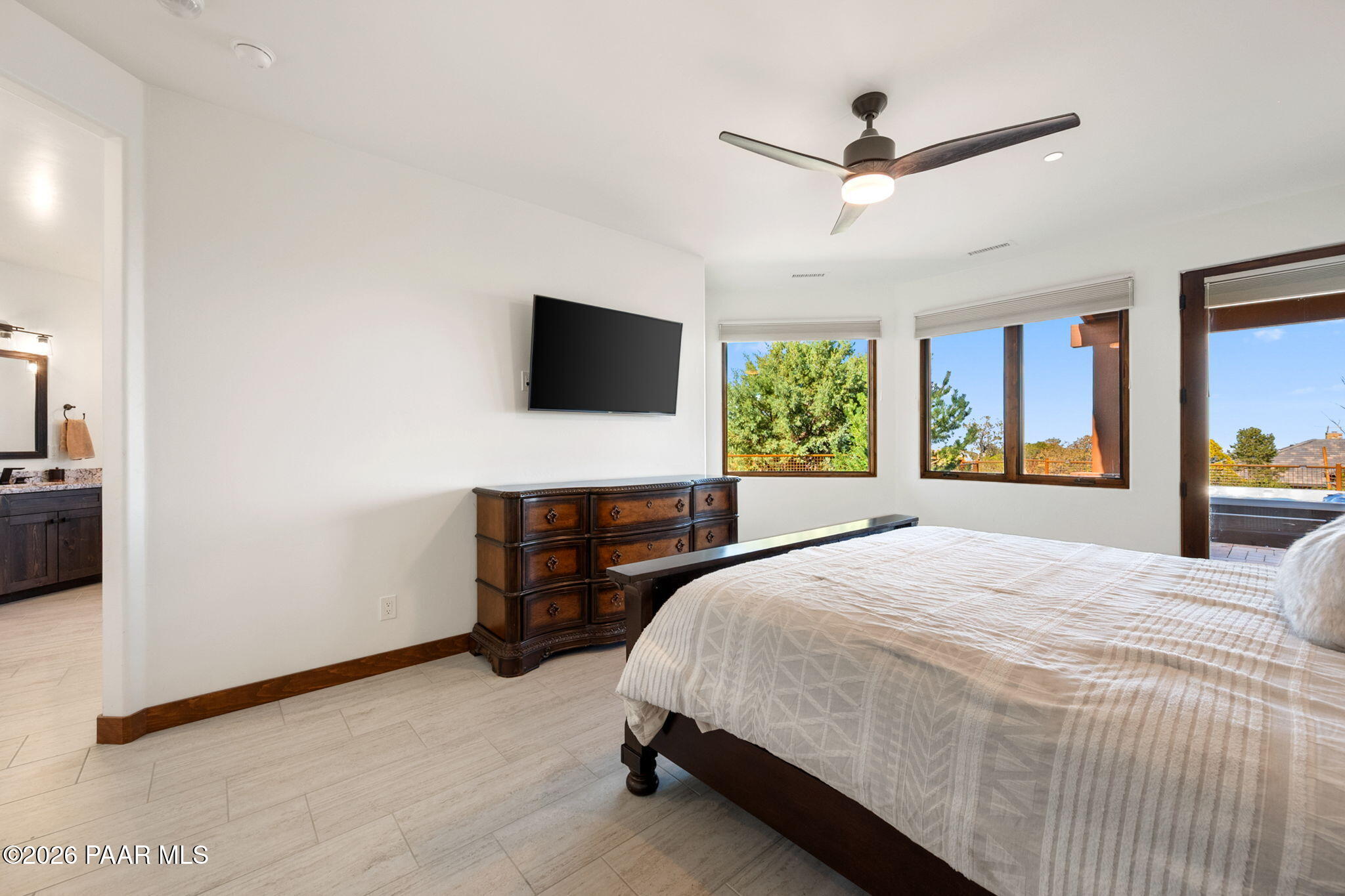 2140 Forest Mountain Road Prescott, AZ 86303 - Photo 21 of 56 a bedroom with a bed window and a flat screen tv