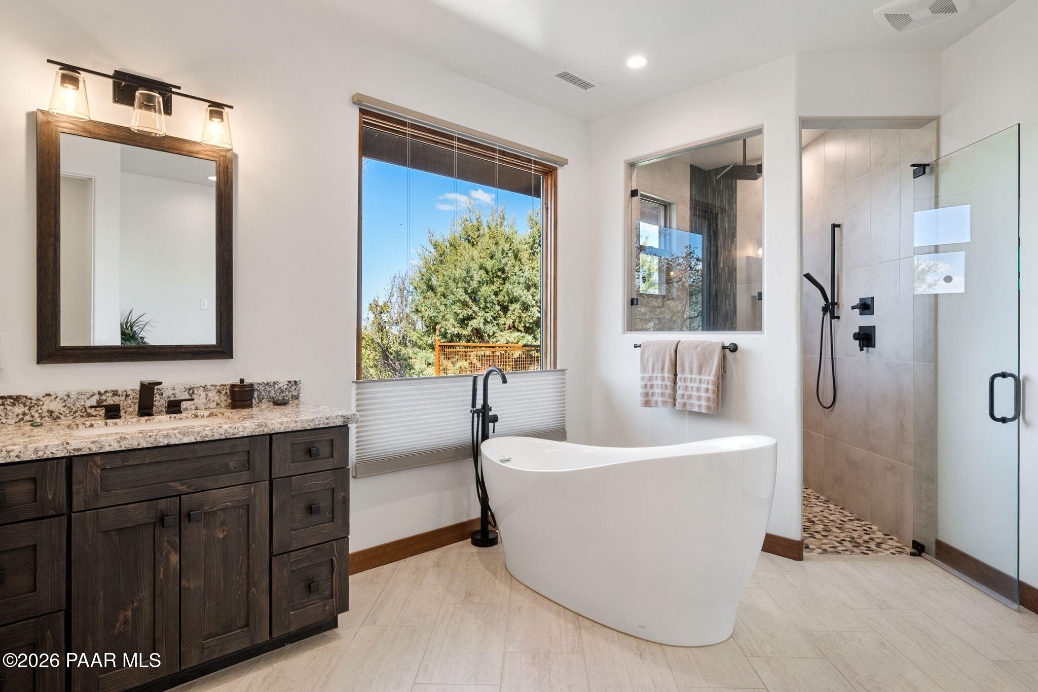 2140 Forest Mountain Road Prescott, AZ 86303 - Photo 23 of 56 a bathroom with a tub sink and mirror