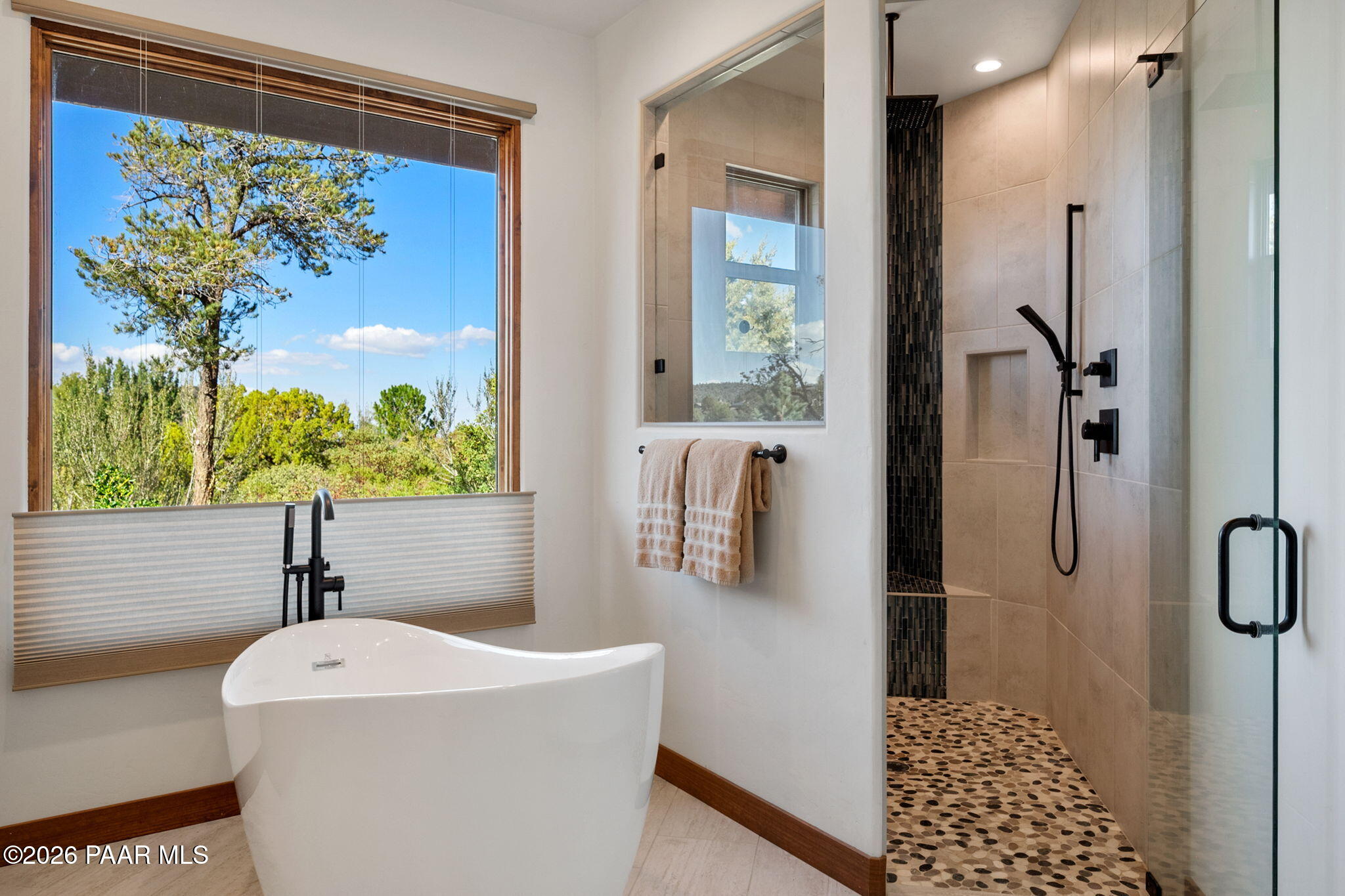 2140 Forest Mountain Road Prescott, AZ 86303 - Photo 25 of 56 a bathroom with a sink a mirror and a shower