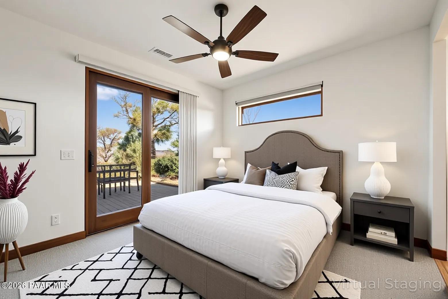 2140 Forest Mountain Road Prescott, AZ 86303 - Photo 30 of 56 a bedroom with bed and a large window