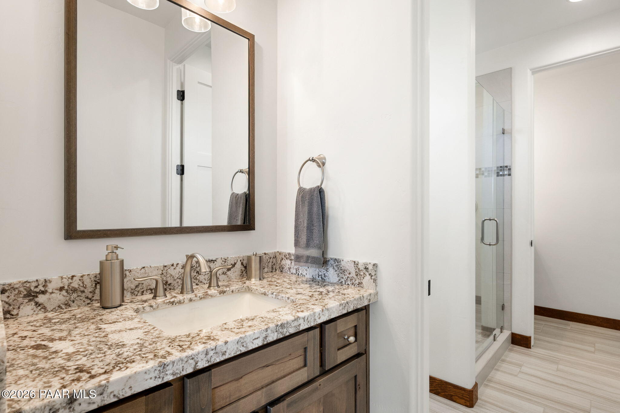 2140 Forest Mountain Road Prescott, AZ 86303 - Photo 33 of 56 a bathroom with a granite countertop sink and a mirror