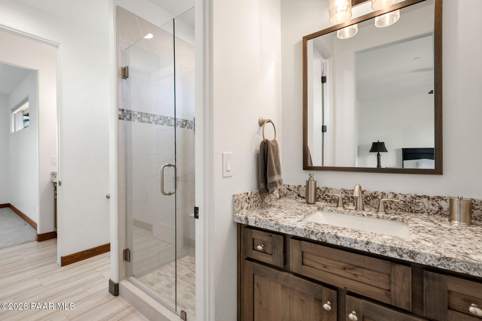 2140 Forest Mountain Road Prescott, AZ 86303 - Photo 34 of 56 a bathroom with a granite countertop shower sink and mirror