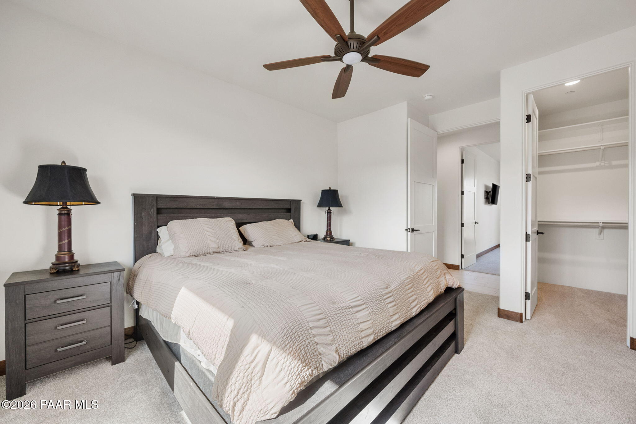 2140 Forest Mountain Road Prescott, AZ 86303 - Photo 35 of 56 a bedroom with a bed and a lamp on a dresser