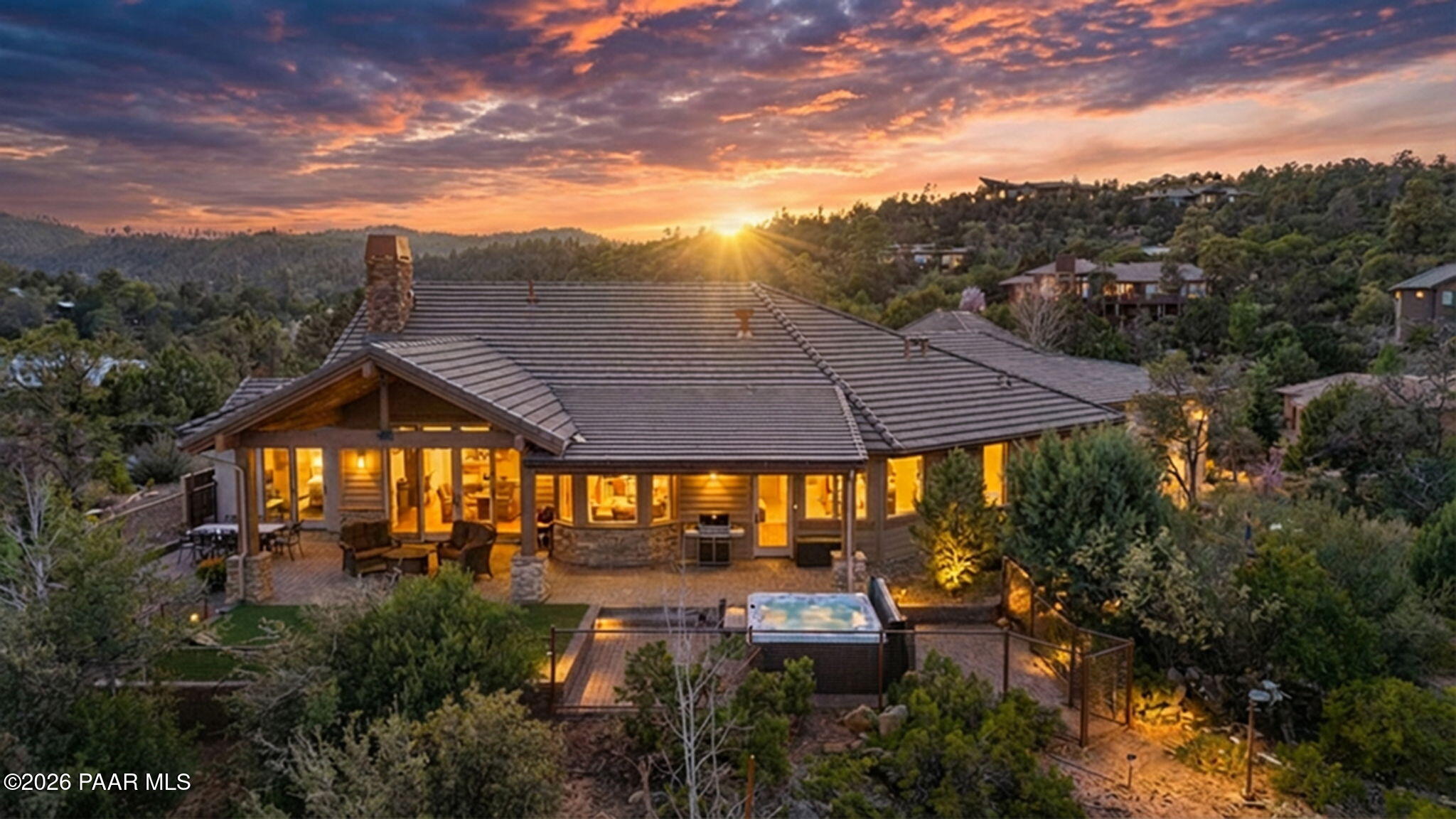 2140 Forest Mountain Road Prescott, AZ 86303 - Photo 50 of 56 a view of a patio with table and chairs under an umbrella