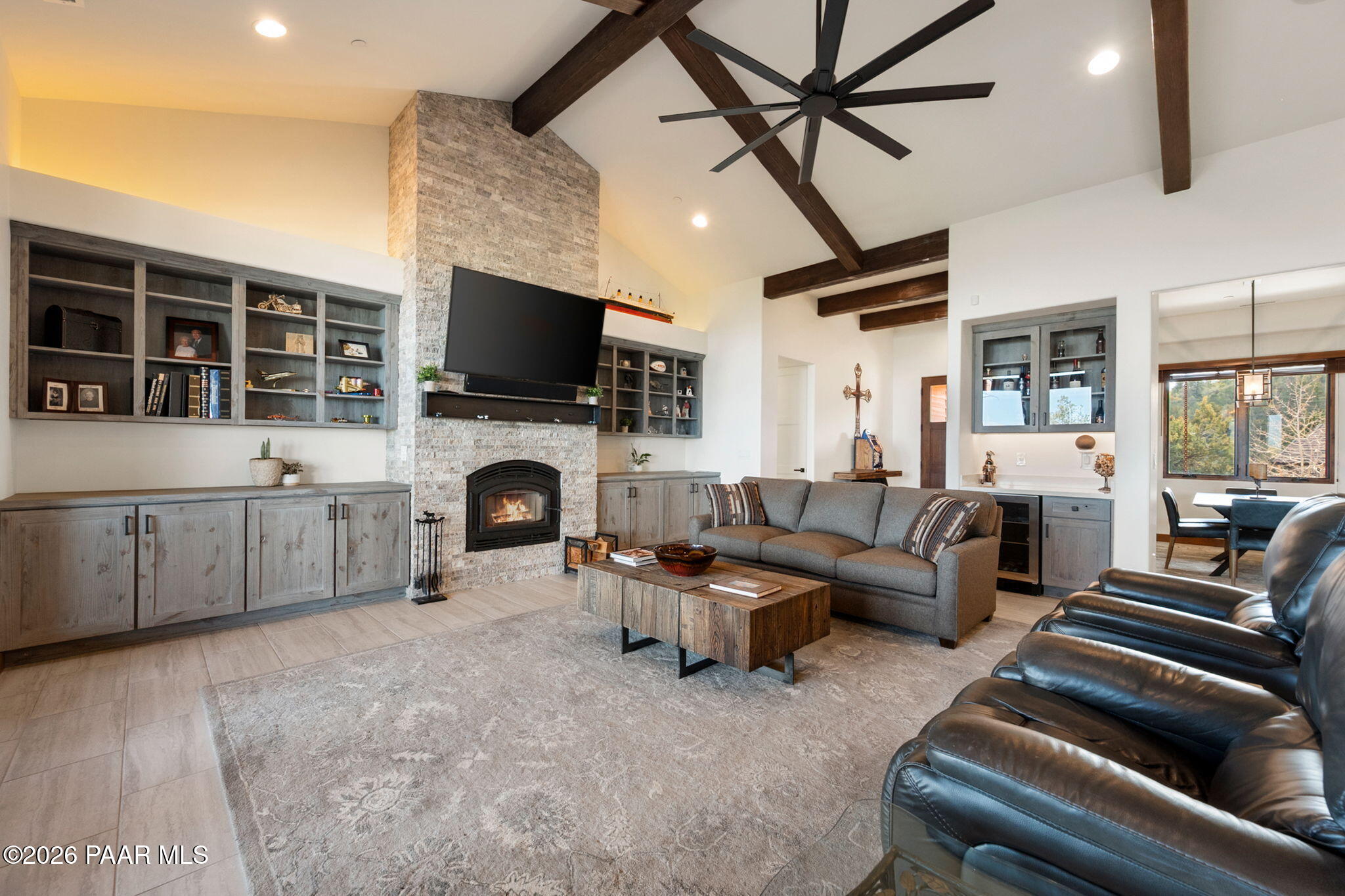 2140 Forest Mountain Road Prescott, AZ 86303 - Photo 8 of 56 a living room with furniture a fireplace and a flat screen tv