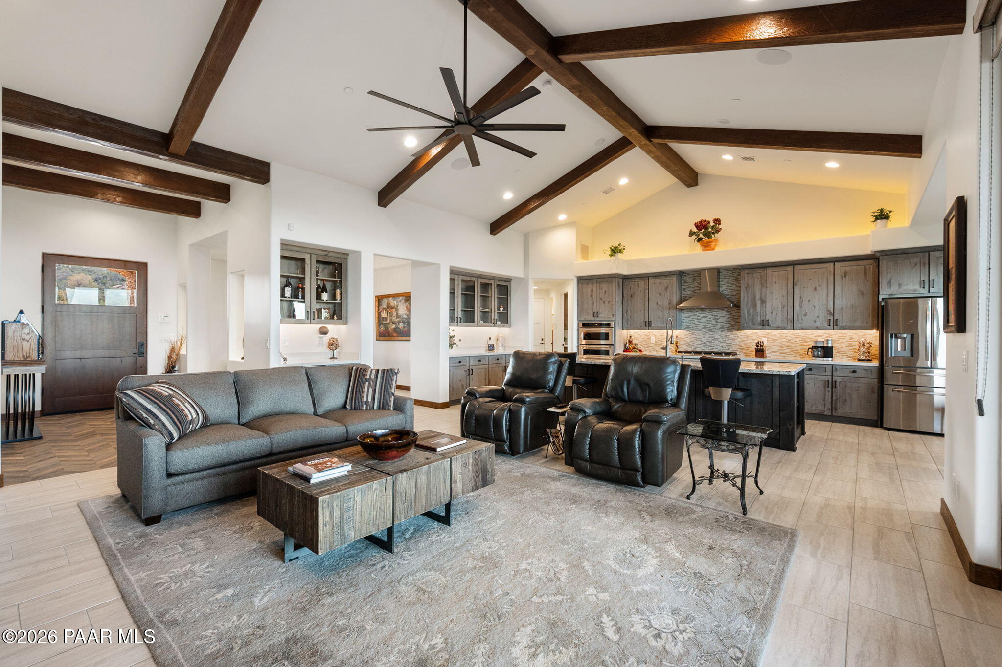 2140 Forest Mountain Road Prescott, AZ 86303 - Photo 9 of 56 a living room with furniture kitchen view and a wooden floor