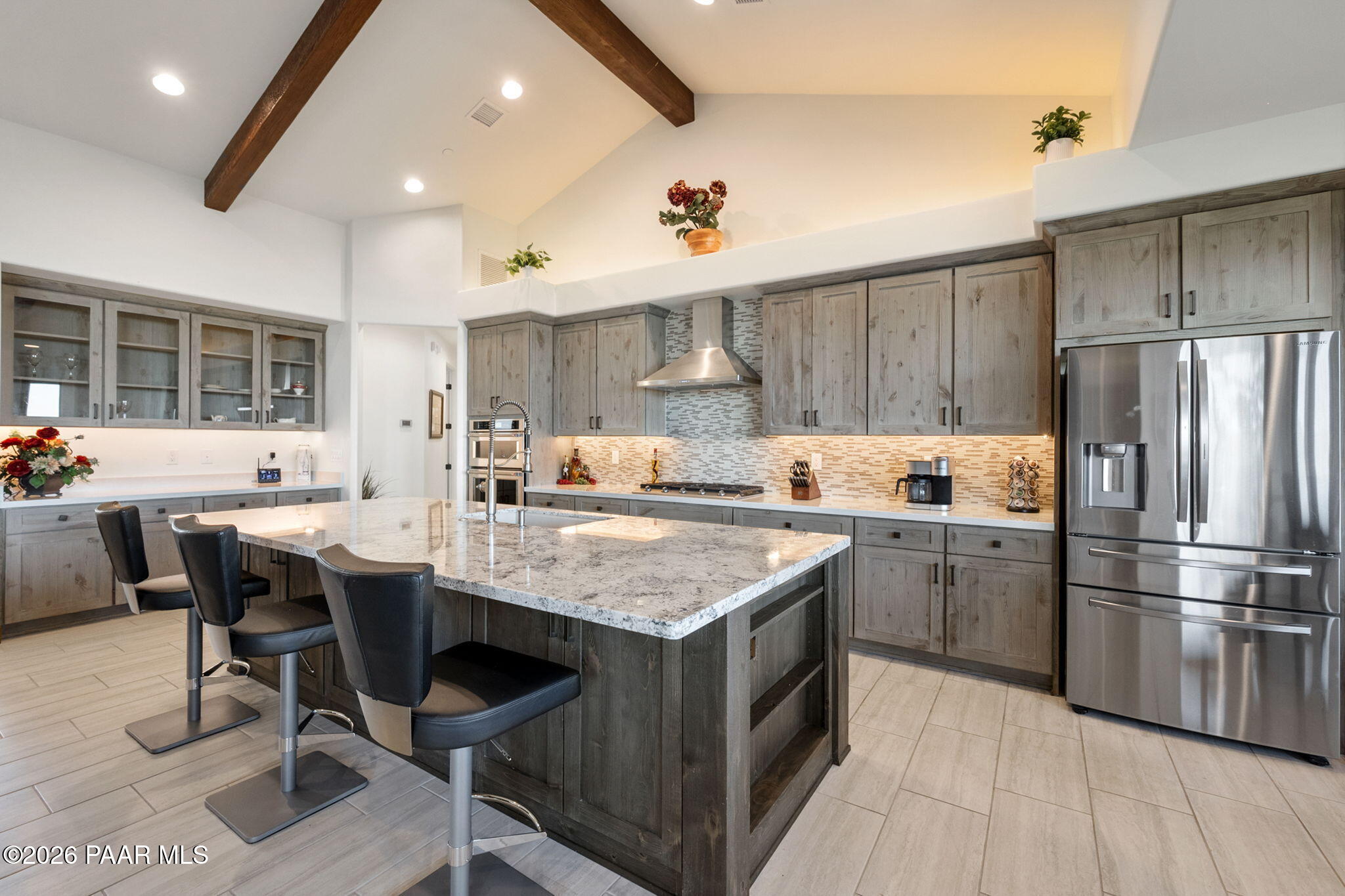 2140 Forest Mountain Road Prescott, AZ 86303 - Photo 10 of 56 a kitchen with stainless steel appliances granite countertop a table chairs sink refrigerator and cabinets