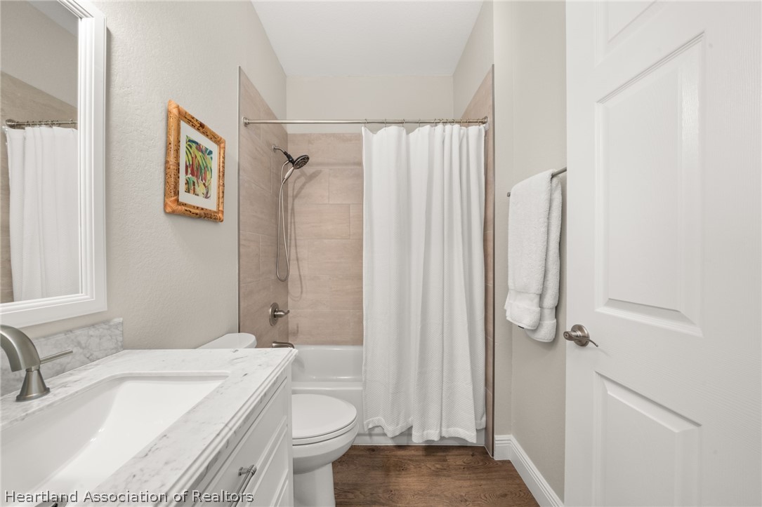 4734 Haw Branch Road, Unit 110 Sebring, FL 33875 - Photo 30 of 50 a bathroom with a sink toilet and shower