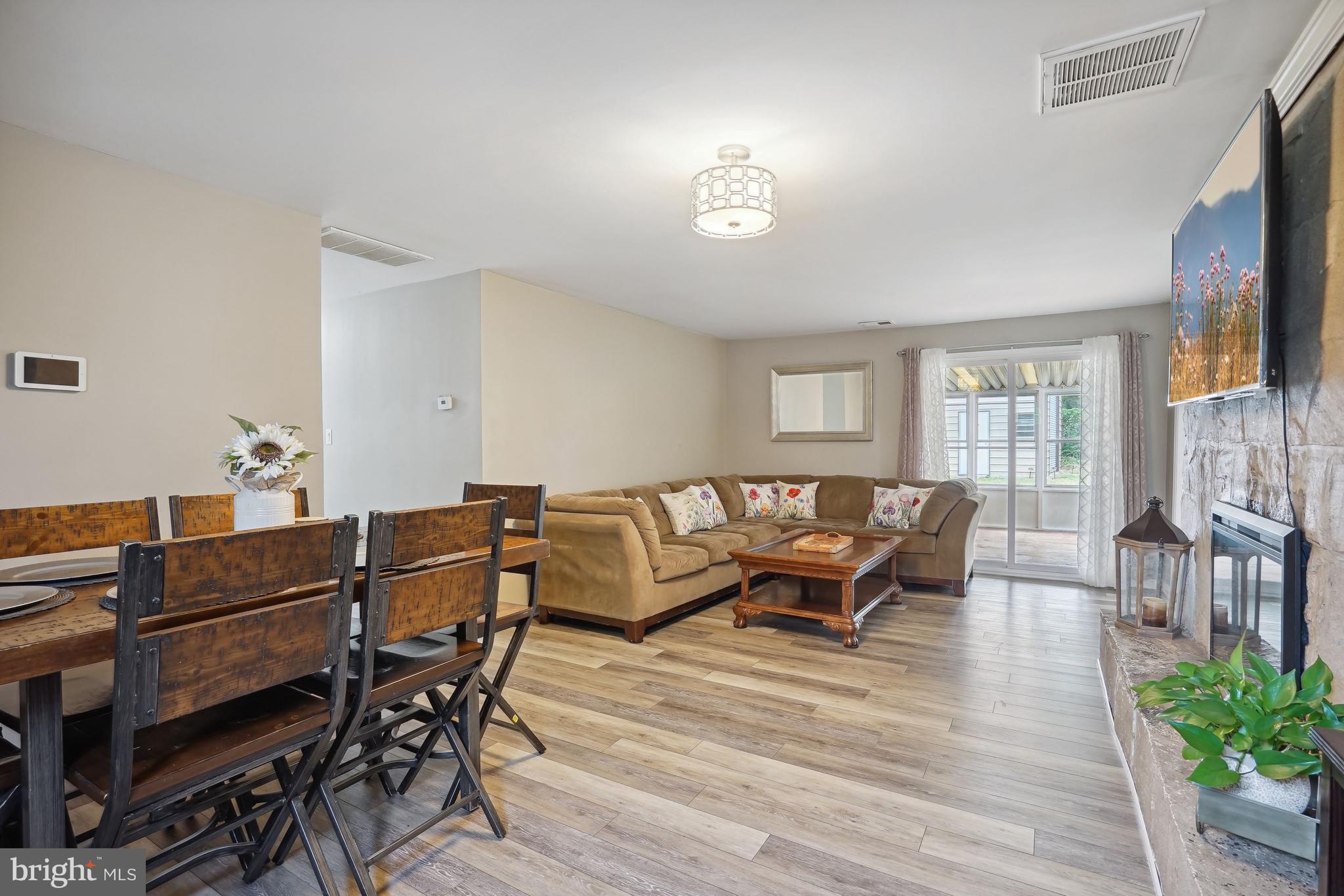 6000 Accokeek Road Brandywine, MD 20613 - Photo 3 of 31 Open floor plan with LVP flooring and wood burning