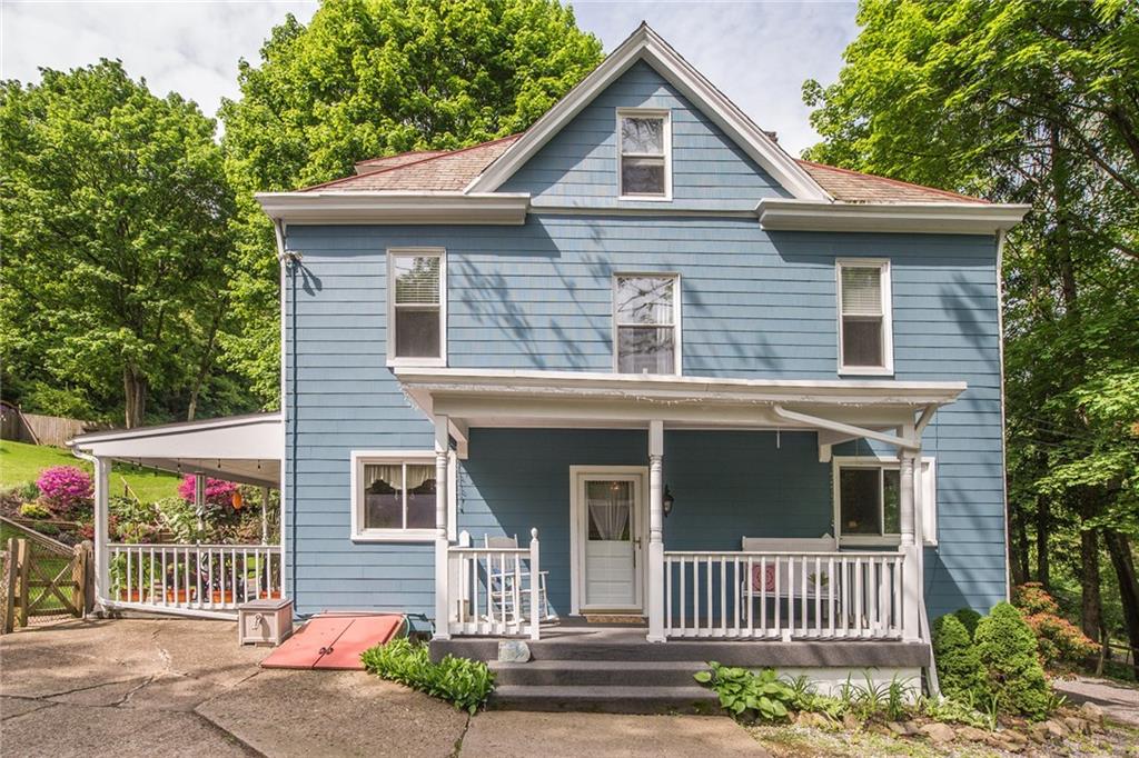 This special home set on a private lot exudes style and elegance with a feeling of history and country charm.