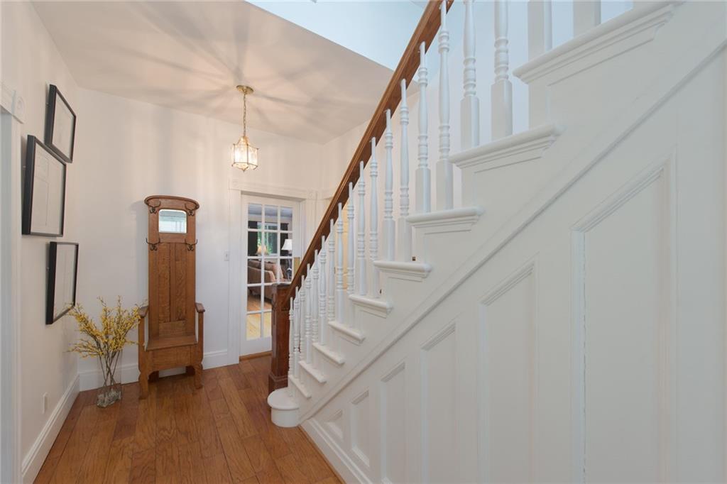 1 Quarry Road Sewickley, PA 15143 - Photo 2 of 25 Paneled stairwell and wood floors add character to the entryway.
