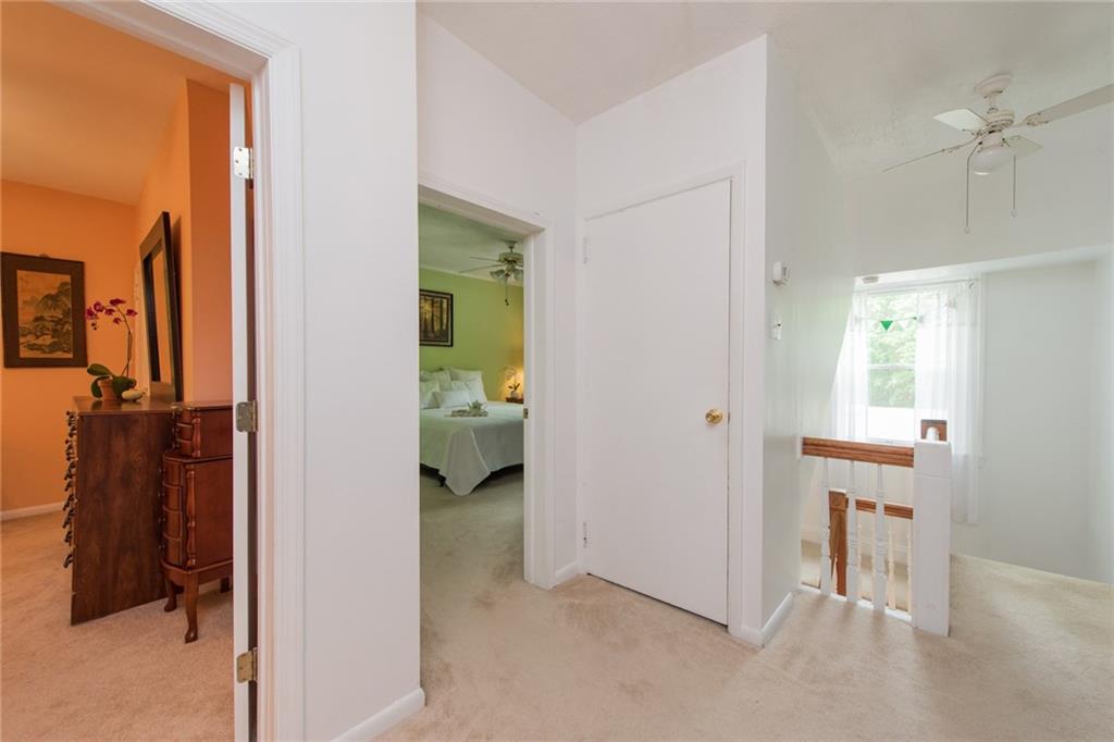 1 Quarry Road Sewickley, PA 15143 - Photo 11 of 25 Light fills the upper stairwell landing leading into the bedrooms.