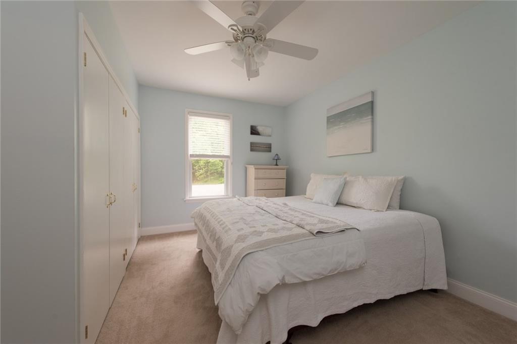 1 Quarry Road Sewickley, PA 15143 - Photo 14 of 25 Another guest bedroom includes large closets and a ceiling fan.