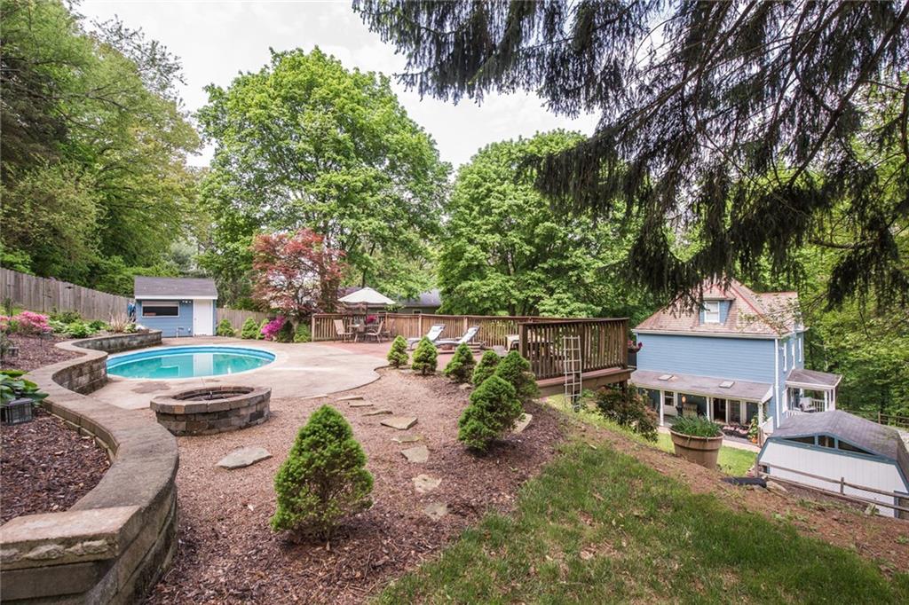1 Quarry Road Sewickley, PA 15143 - Photo 24 of 25 A large deck for lounging surrounds the pool creating a private get-away.