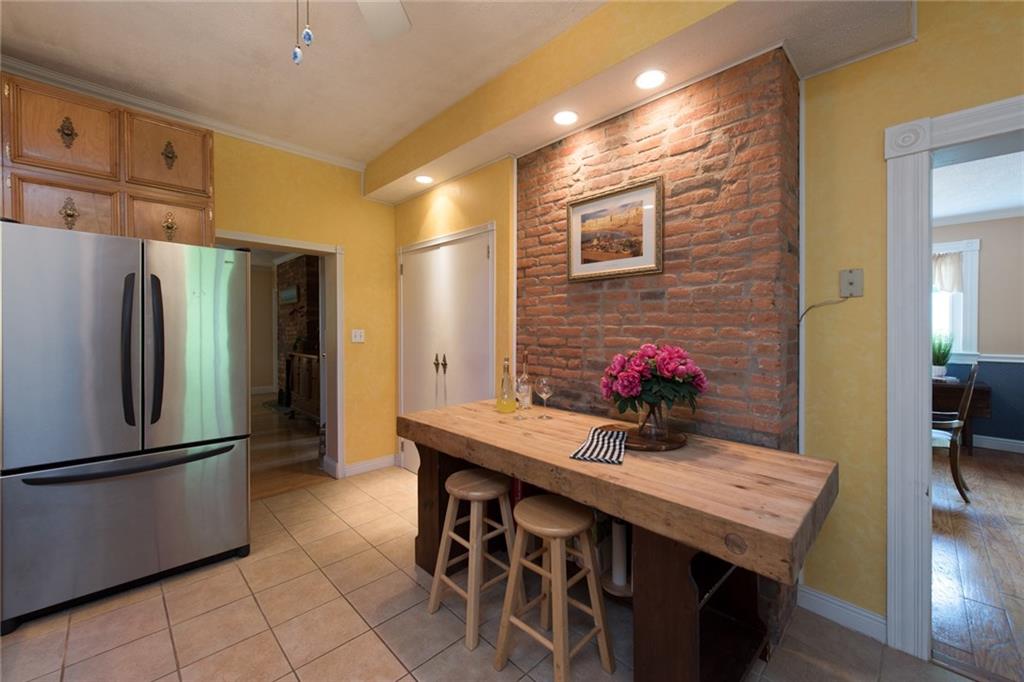 1 Quarry Road Sewickley, PA 15143 - Photo 5 of 25 Exposed brick on the kitchen wall speaks to the history of the home and adds warmth.