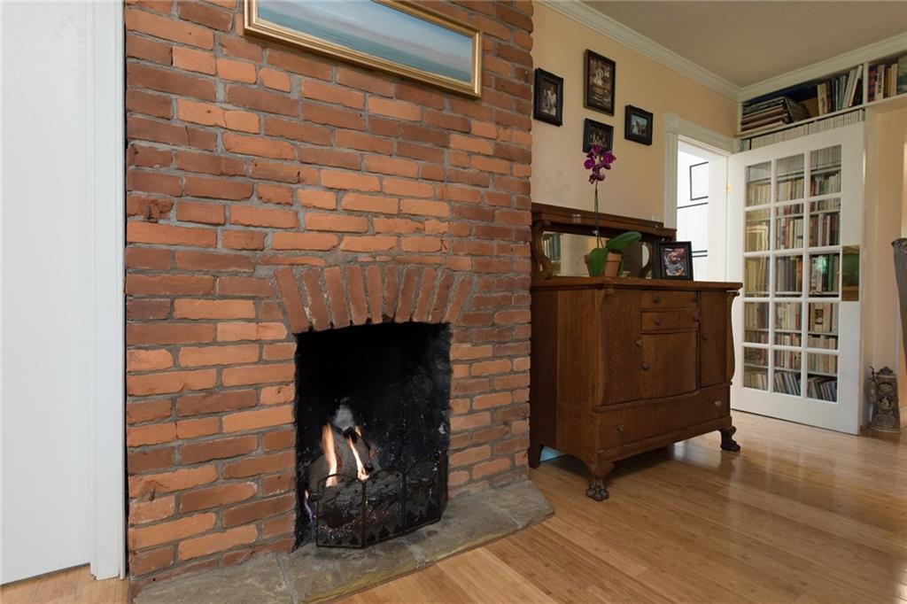 1 Quarry Road Sewickley, PA 15143 - Photo 8 of 25 The gas fireplace in the living room adds historic charm to this home.