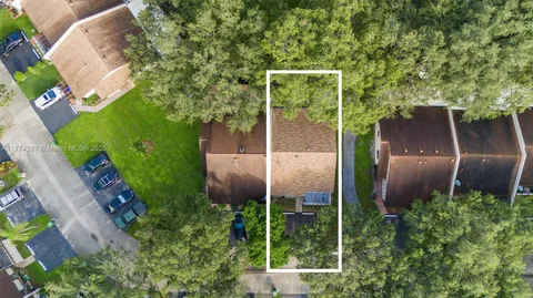 an aerial view of residential building with parking space