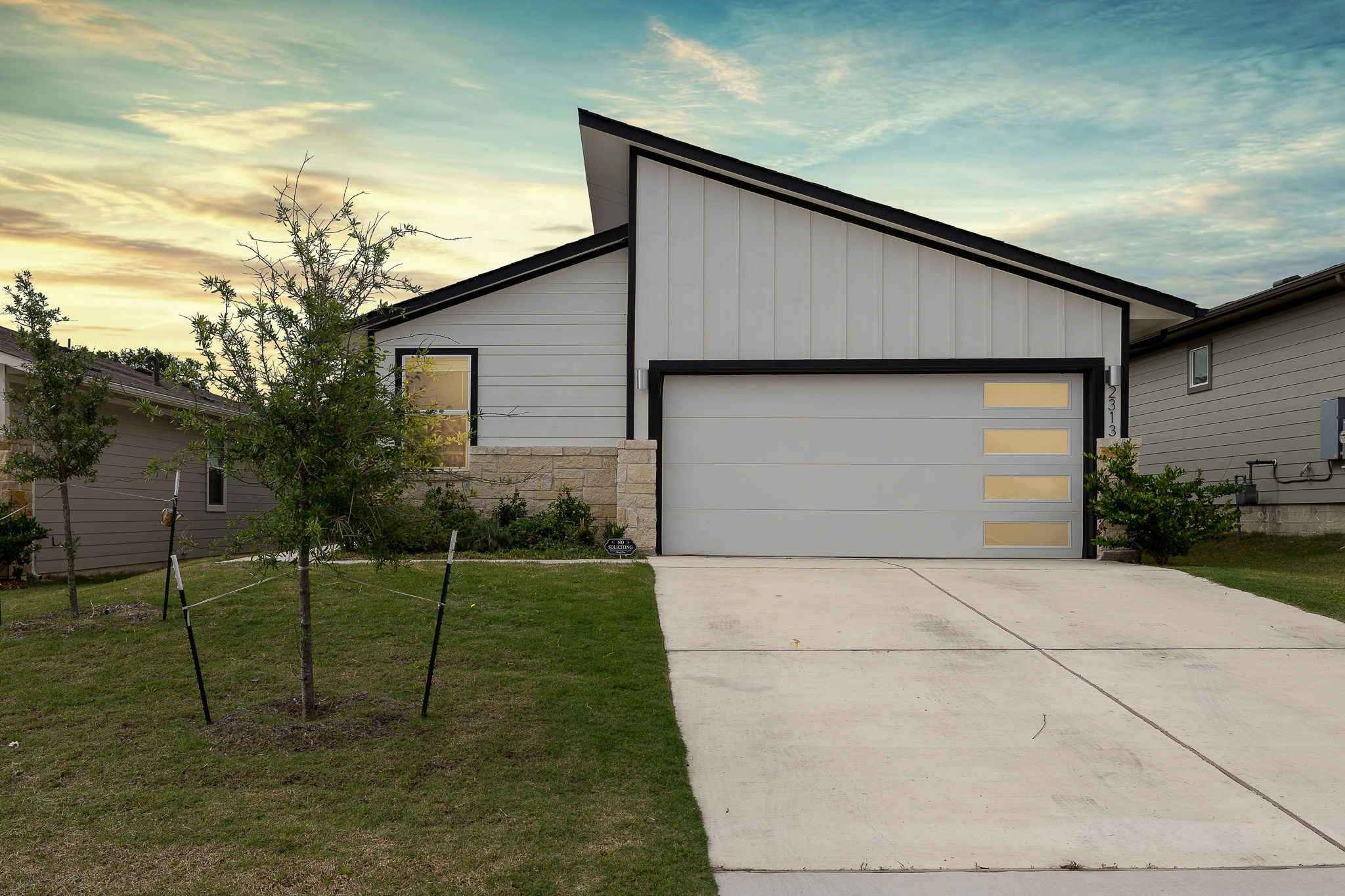 2313 Ranier Court Austin, TX 78754 - Photo 2 of 22 a front view of house along with trees