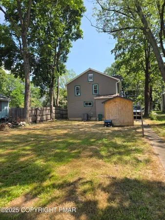 a front view of house with garden