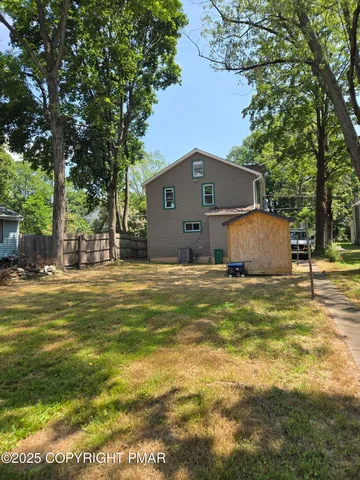 a front view of house with garden