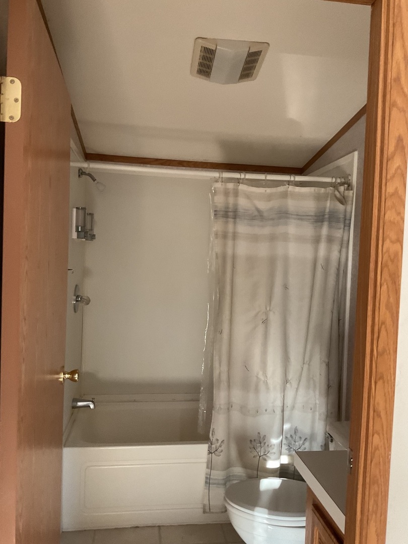 281 Misty Ridge Lakemoor, IL 60051 - Photo 12 of 16 a bathroom with a shower and a tub
