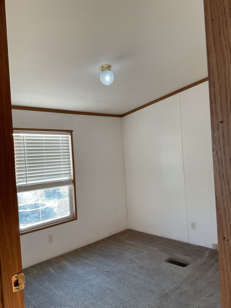 281 Misty Ridge Lakemoor, IL 60051 - Photo 10 of 16 an empty room with windows