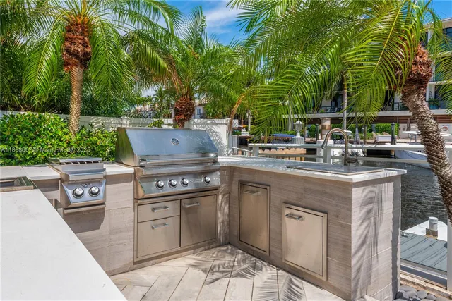a spacious bedroom with a bed and a chandelier