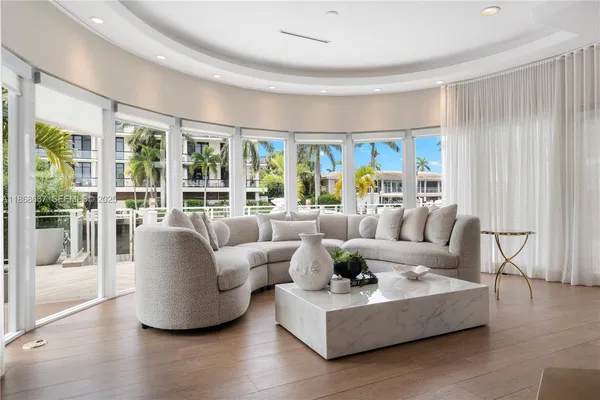 a living room with furniture chandelier and a chandelier