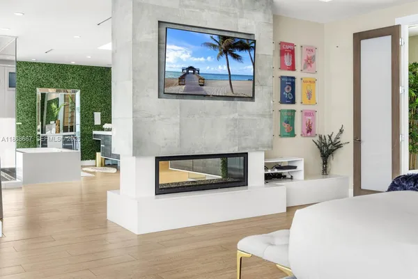a bedroom with furniture and a chandelier