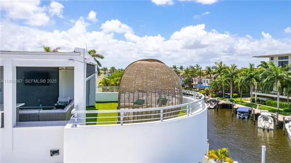 a bedroom with bed and a large window