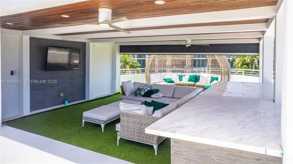 a spacious bedroom with a bed a table and chair