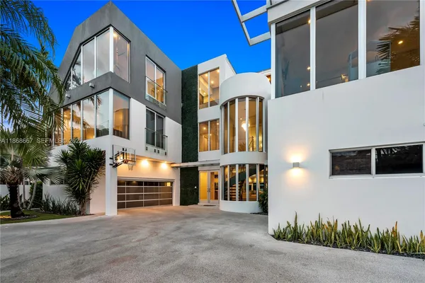 a view of a building with a dining table and chairs