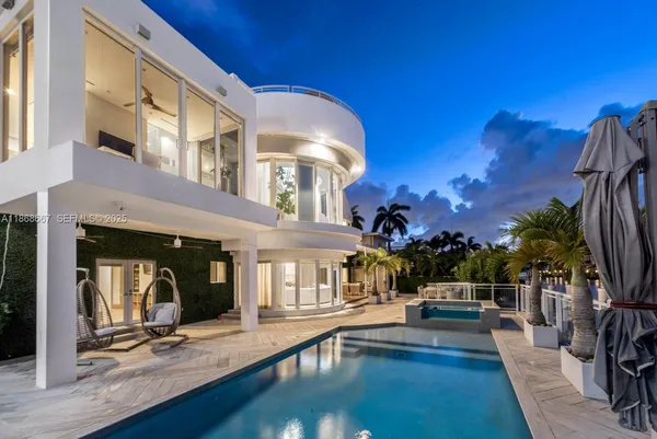 a view of a chair and tables in the patio