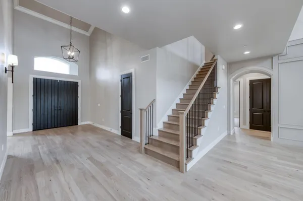 a view of a livingroom with a ceiling fan and window