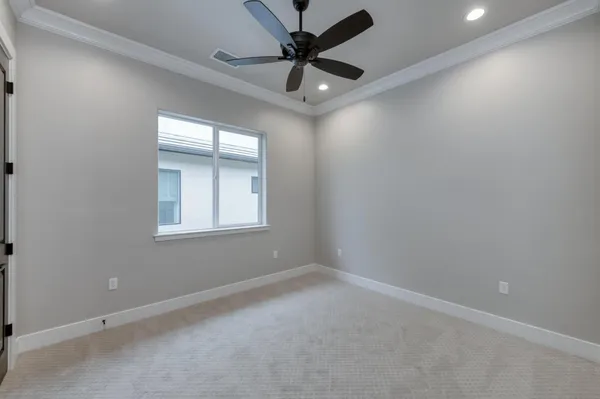 a view of walk in closet with empty racks