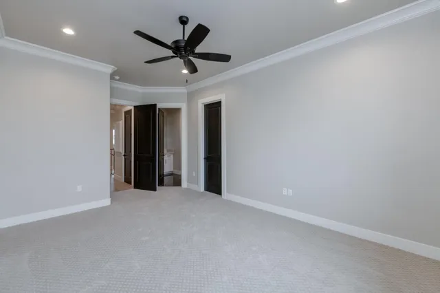 a front view of a house with a garden and patio