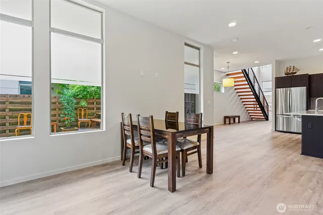 a dining room with furniture and entryway