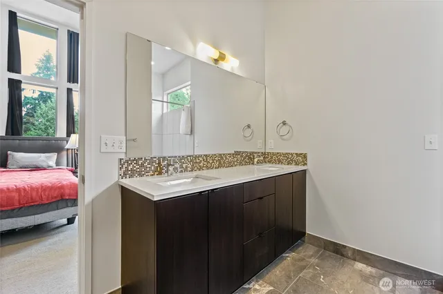 a bathroom with a sink and a mirror